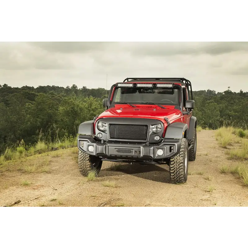 Rugged Ridge Spartacus Front Bumper Black on Jeep Wrangler parked on dirt road