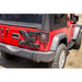Red Jeep with black top and bumper by Rugged Ridge Spartacus HD Tire Carrier for Jeep Wrangler JK