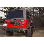 Red Jeep with black top parked on dirt - Rugged Ridge Spartacus HD Tire Carrier Hinge Casting 97-06 TJ