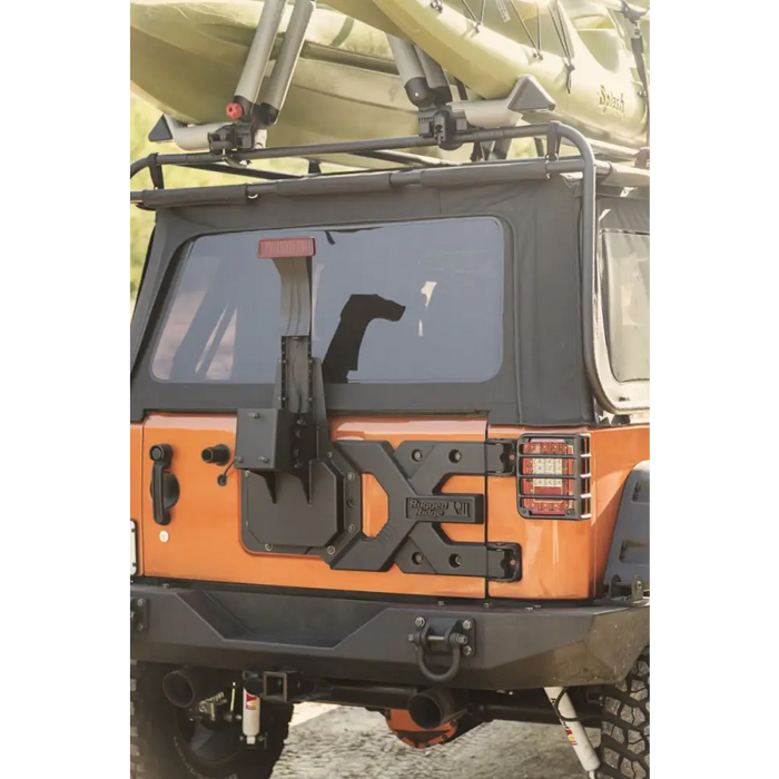 Rugged Ridge Spartacus HD Tire Carrier Kit on Jeep Wrangler with Kayak