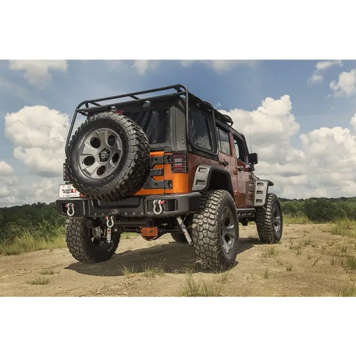 Black Rugged Ridge Spartacus Rear Bumper parked Jeep Wrangler on dirt road