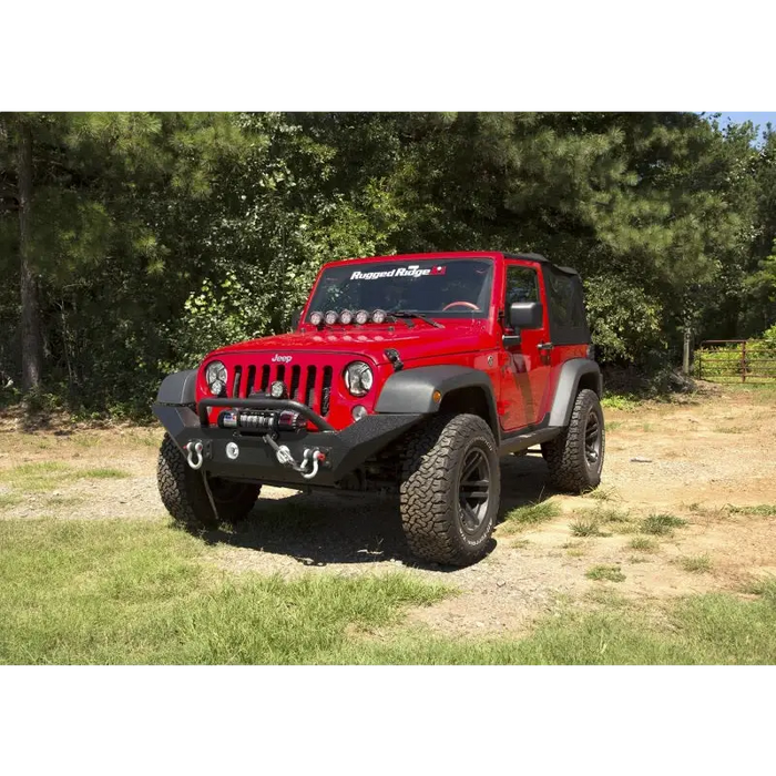 Red Jeep parked in grass - Rugged Ridge Spartan Front Bumper HCE w/Overrider 07-18 Jeep Wrangler JK