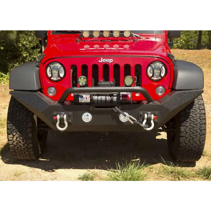 Close-up of red Jeep with black bumper - Rugged Ridge Spartan Front Bumper HCE w/Overrider for 07-18 Jeep Wrangler JK.