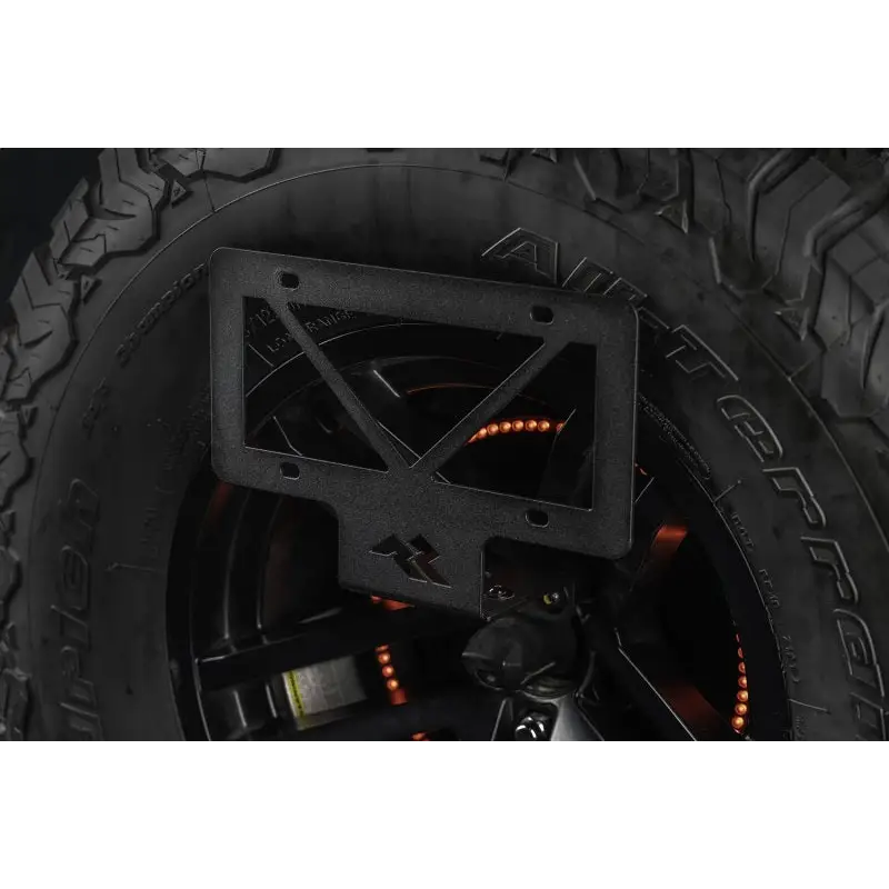 Rugged Ridge Tag Relocation Bracket for Jeep Wrangler JL - Black ATV front wheel.