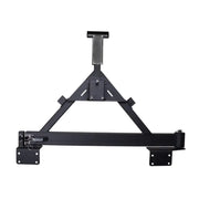 Black metal shelf with bracket mounted on wall, Rugged Ridge Tire Carrier XHD Rear Bumper for Jeep Wrangler.