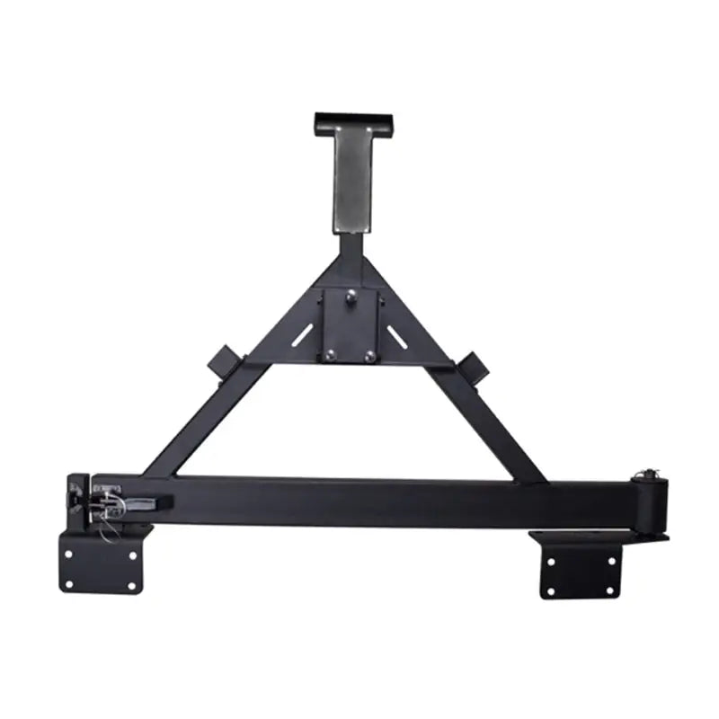 Black metal shelf with bracket mounted on wall, Rugged Ridge Tire Carrier XHD Rear Bumper for Jeep Wrangler.