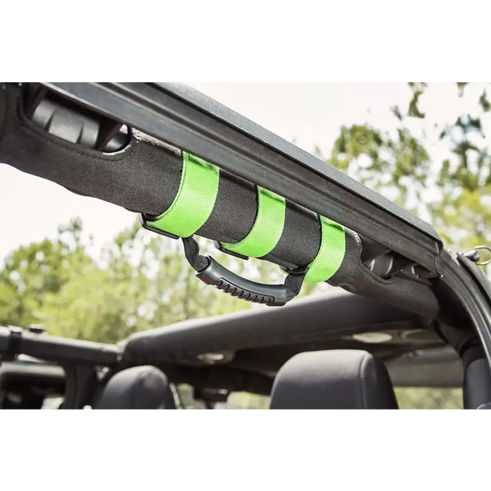 Rugged Ridge Ultimate Grab Handles Green attached to car roof.