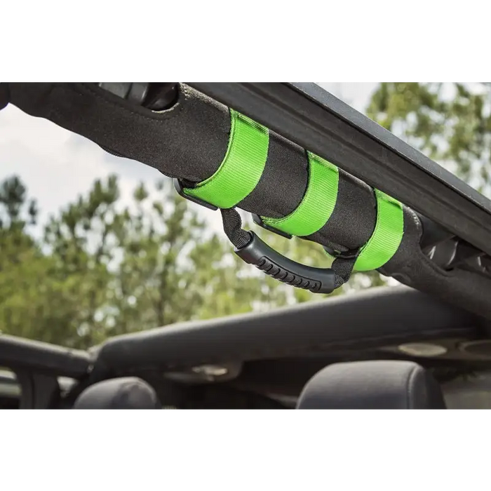 Rugged Ridge Ultimate Grab Handles in Green attached to a roof rack on a Jeep Wrangler.