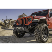 Red Jeep parked in dirt lot - Rugged Ridge Venator Front Bumper for Jeep Wrangler.
