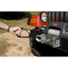 Rugged Ridge Winch Safety Strap with man pulling winch hook on jeep Wrangler