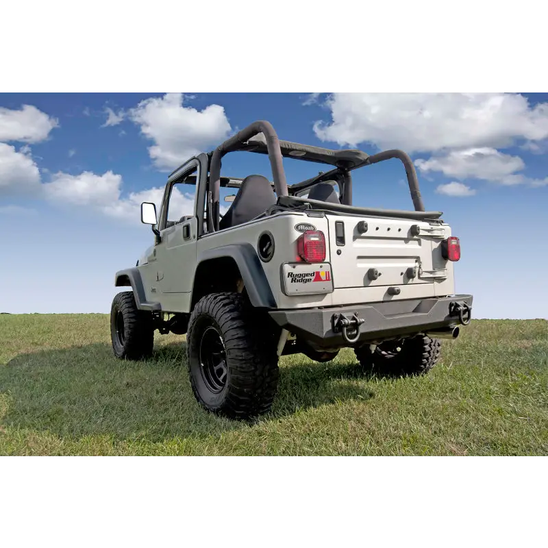 Jeep parked in grass near Rugged Ridge XHD Rear Bumper.