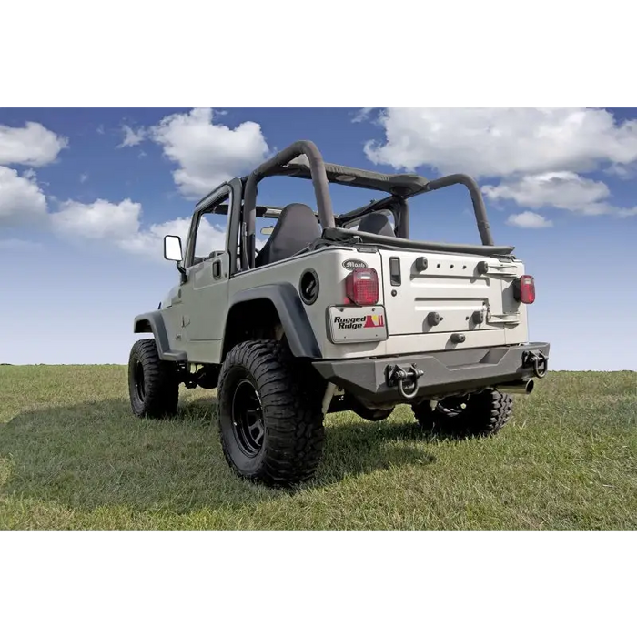 Rugged Ridge XHD Rear Bumper for Jeep parked in grass