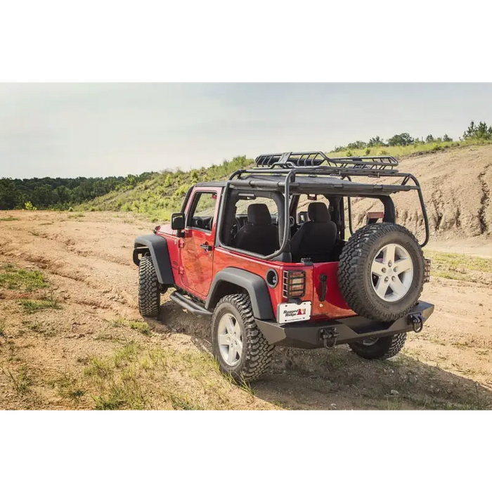 Rugged Ridge XHD Rear Bumper on Jeep parked on dirt road