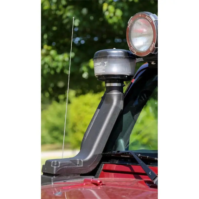 Close up of red car hood light on Rugged Ridge XHD Snorkel Pre-filter.