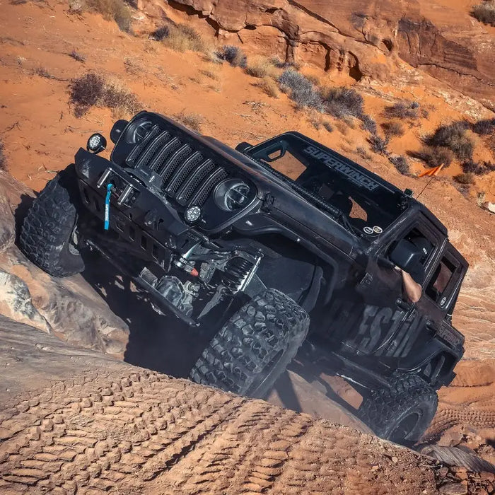 Black jeep driving through desert with 3/8in x 85ft wire rope.