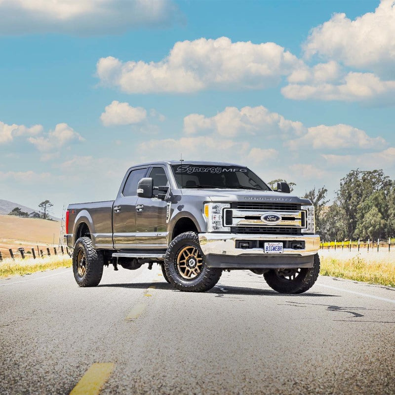 Silver ford f-350 truck parked on country road - synergy 05+ ford super duty f-250 / f-350ax4 diesel leveling system