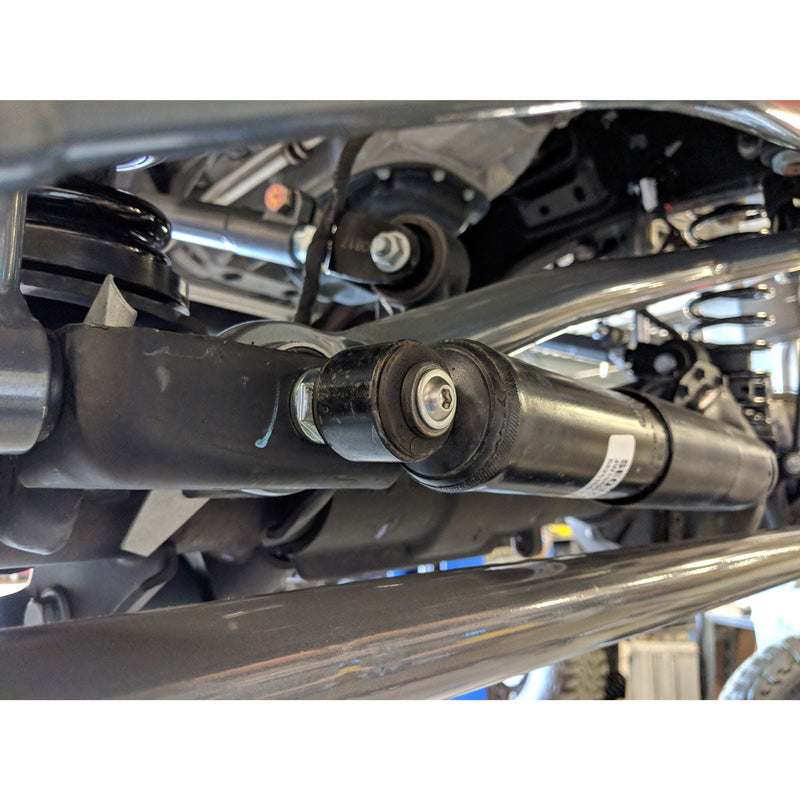 Close up of jeep jk steering stabilizer mount & tie rod clamp suspension system