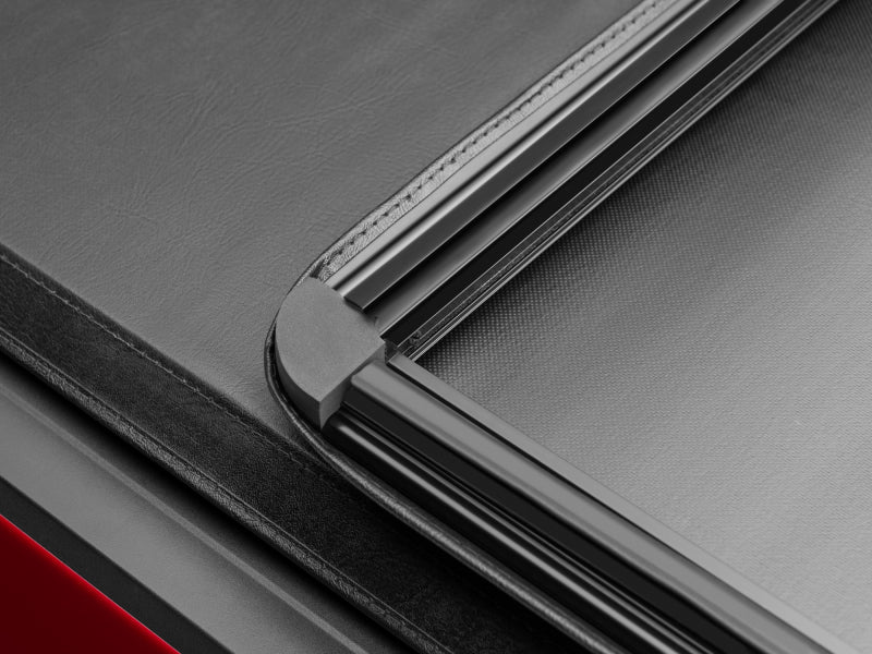 Red car with black leather tonneau cover - tonno pro tri-fold tonneau cover for toyota tacoma 5ft fleetside