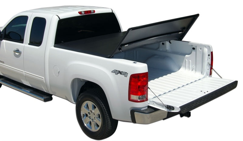 Tonno pro tri-fold tonneau cover on white truck with black bed cover