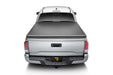 Silver truck displaying truxedo 05-15 toyota tacoma 5ft truxport bed cover from the back