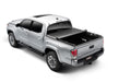 Truxedo 05-15 toyota tacoma 5ft truxport truck bed cover displayed in the back of a truck