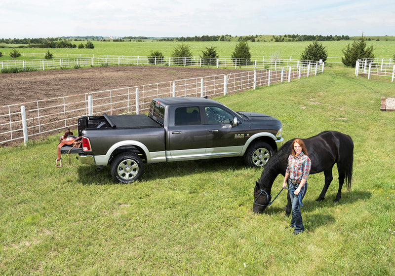 Woman standing next to horse in field, truxedo truxport bed cover for toyota tacoma 5ft bed