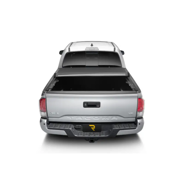 Silver truck rear view with Truxedo 16-20 Toyota Tacoma 5ft Pro X15 Bed Cover.
