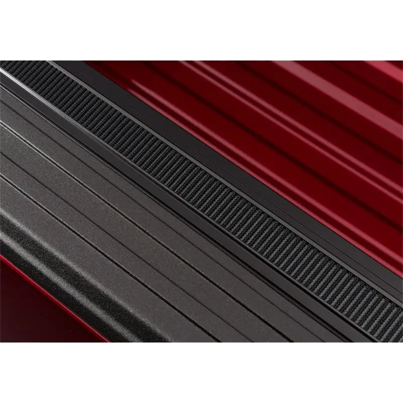 Close-up of red car side step on Truxedo Pro X15 Bed Cover.