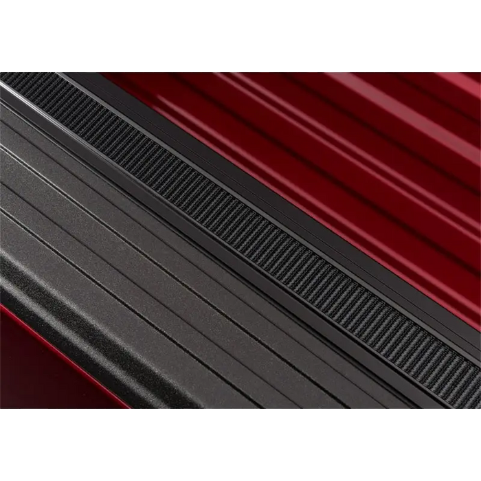 Close-up of red car side step on Truxedo Pro X15 Bed Cover.
