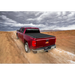 Red truck driving down dirt road - Truxedo 16-20 Toyota Tacoma Pro X15 Bed Cover.