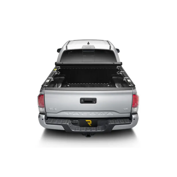 Truxedo 16-20 Toyota Tacoma 6ft TruXport Bed Cover showing rear view of silver truck