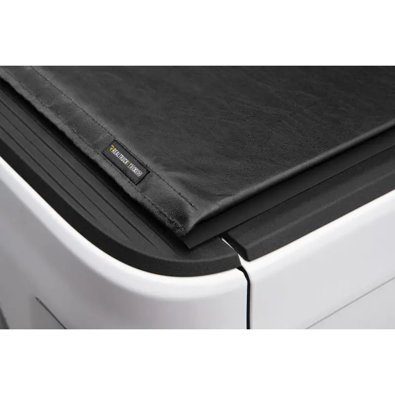 Truxedo 2020 Jeep Gladiator black leather truck bed cover folded over printer.