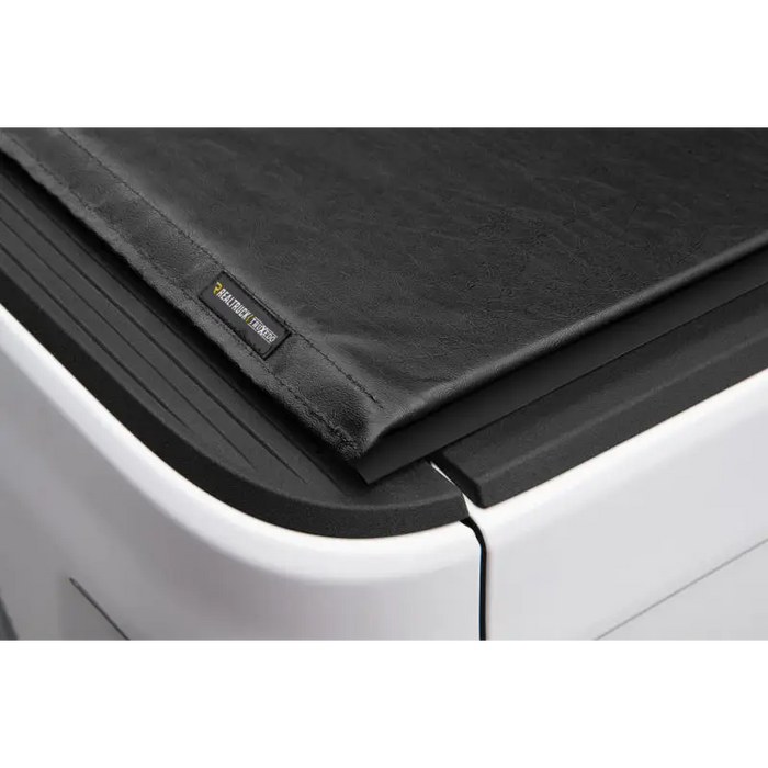 Truxedo 2020 Jeep Gladiator black leather truck bed cover folded over printer.
