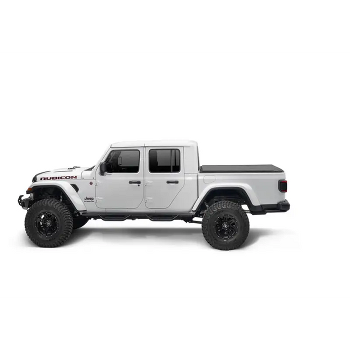 Truxedo 2020 Jeep Gladiator 5ft Lo Pro Bed Cover featuring white jeep with black wheels and tires
