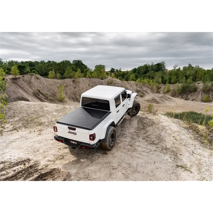 Truxedo 2020 Jeep Gladiator 5ft Lo Pro Bed Cover on a dirt road