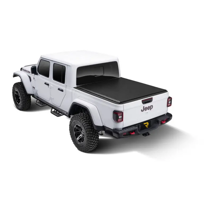Truxedo 2020 Jeep Gladiator 5ft Lo Pro Bed Cover truck bed cover with white truck, black wheels, and black top.