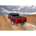 Red truck driving down dirt road, Truxedo Pro X15 Bed Cover for Jeep Wrangler.