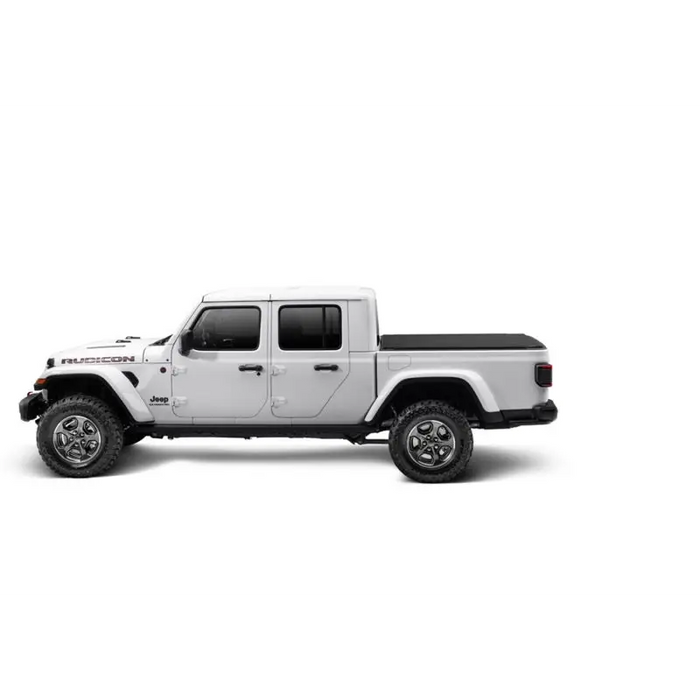 Truxedo 2020 Jeep Gladiator 5ft Sentry CT Bed Cover with a white jeep and black bumper