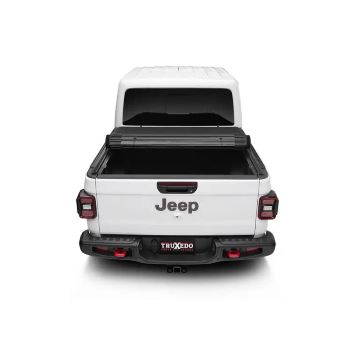 Rear view of 2019 GMC truck with Truxedo 2020 Jeep Gladiator 5ft Sentry CT Bed Cover.
