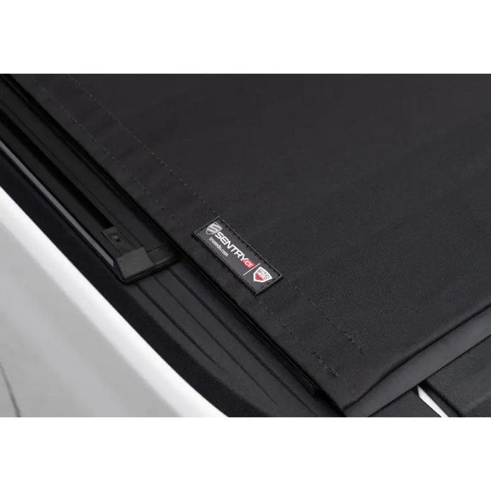 Truxedo 2020 Jeep Gladiator 5ft Sentry CT Bed Cover installation instructions on black cover attached to door.