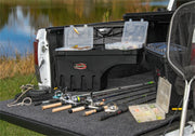 Undercover 05-20 toyota tacoma drivers side swing case with fishing gear in truck bed