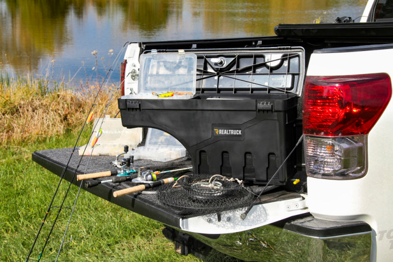Toyota tacoma passengers side swing case with fishing rod in truck bed