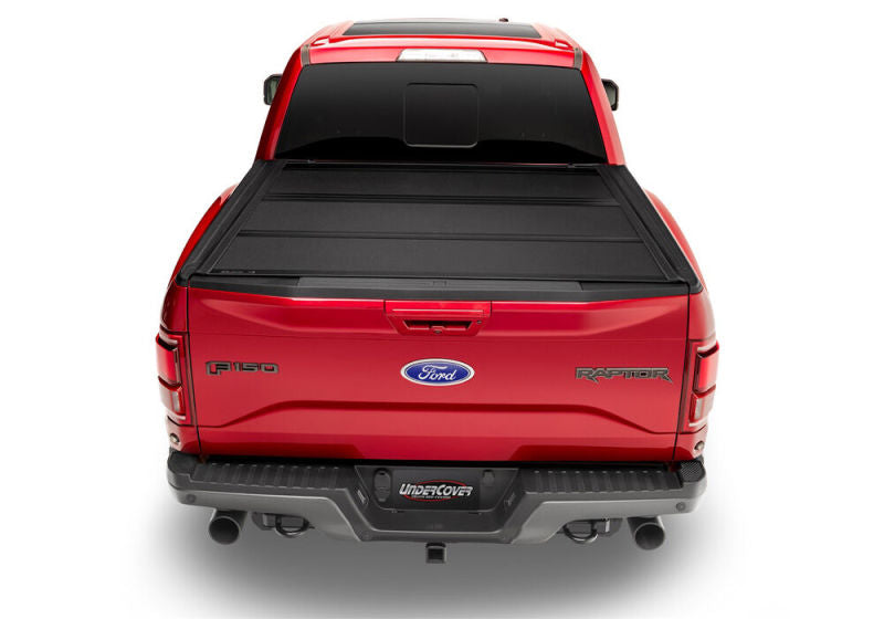 Red 2019 ford f-150 truck with undercover toyota tacoma armor flex bed cover