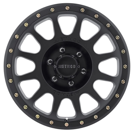 Black and gold fly fishing reel with method mr305 nv 18x9 wheel.