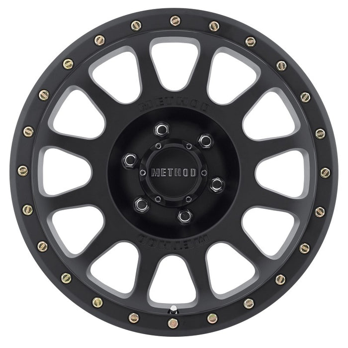 Black and gold fly fishing reel with method mr305 nv 18x9 wheel.