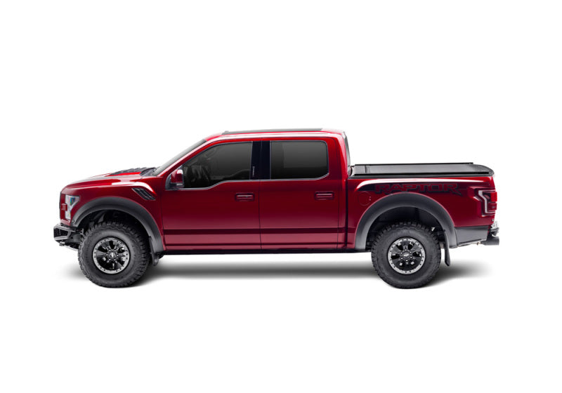 Red truck with black bed cover - retraxone xr for 05-15 tacoma double cab, featuring trax rail.