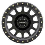 Method mr305 nv 17x8.5 0mm offset 5x150 matte black and gold wheel on white background