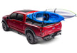 Red truck with surfboard on bed cover: retraxone xr for 05-15 tacoma with trax rail.