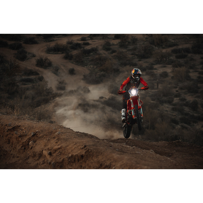 Person riding dirt bike on hill, fits rigid industries single light cover for adapt xp - black.