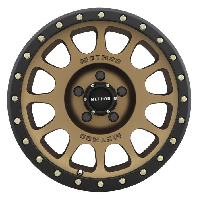 Method mr305 nv 18x9 0mm offset wheel with black rim and gold spokes